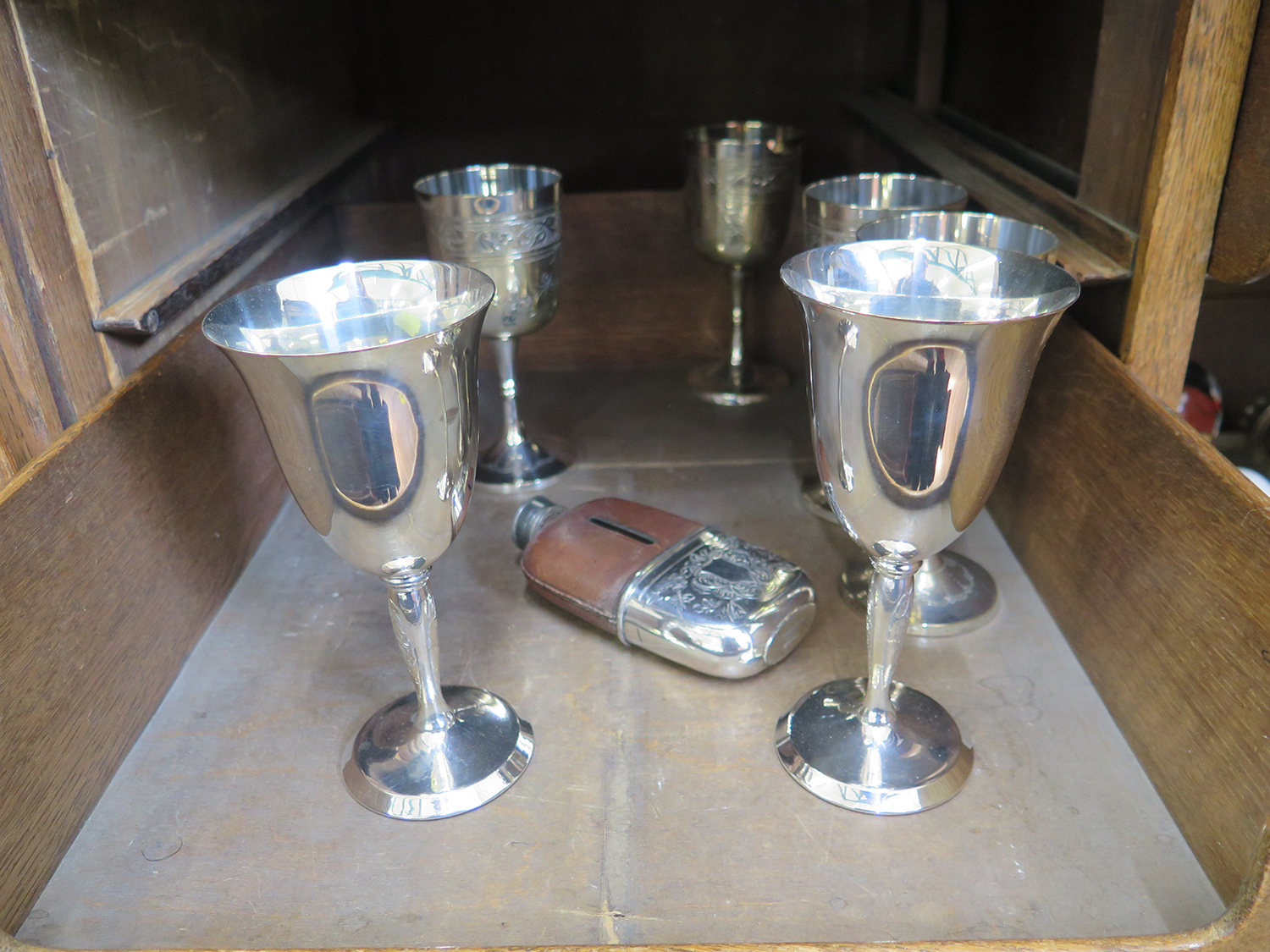 Four plated wine goblets, etc