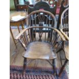 A yew and elm Windsor chair, the spindle back with pierced splat over a moulded seat on ring
