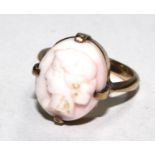 A cameo ring set in 9 carat gold