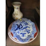 Four pieces of E. Radford floral hand painted pottery comprising a plate, vase and two others,