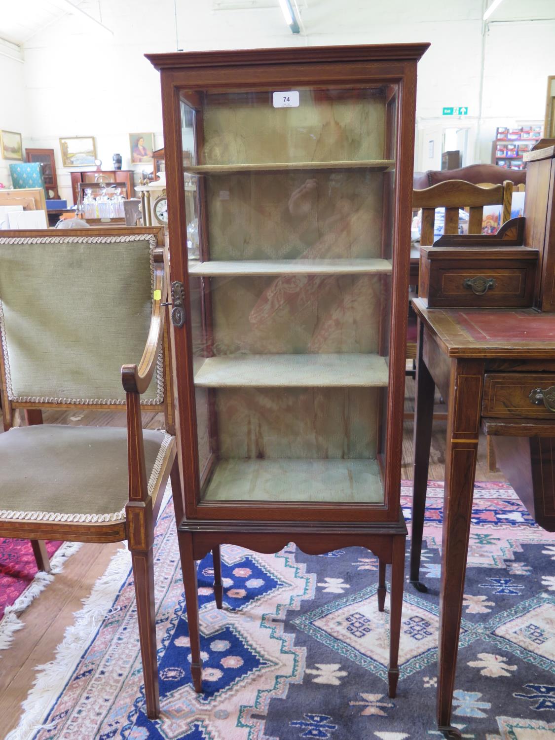 A mahogany and chequer-banded display cabinet, the glazed top over a single door and glazed sides on