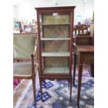 A mahogany and chequer-banded display cabinet, the glazed top over a single door and glazed sides on