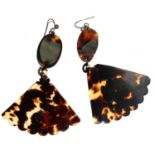 A pair of large tortoiseshell earrings in the form of fans