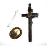 A crucifix, brooch and a silver tie pin