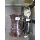 A Bernard Leach Pottery brown glaze stoneware jug, 20 cm high, and a similar brown glaze vase with