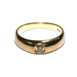 A Gentleman's 9 carat gold ring set with a single diamond