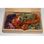 A collection of bead necklaces to include amber, coral, jade, etc