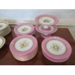 Nine Royal Worcester plates, with pink borders and hand painted floral design centre, 23cm diameter,