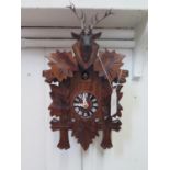 A modern cuckoo clock, 31cm high