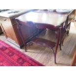 An Edwardian mahogany fold over card table, the shaped top over cabriole legs joined by an