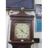 An early 19th century oak longcase clock, with gilded finials over blind fret carved frieze, the