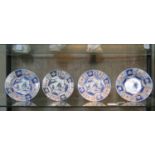 A pair of Chinese 18th century porcelain plates and a pair of matching dishes depicting a pagoda,