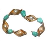A bracelet set with pearls and polished turquoise