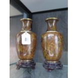 A pair of Japanese cloisonne enamel vases, with all over chrysanthemum design, 20 cm high (2)