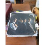 A collection of vinyl albums including an early pressing of The Rolling Stones - The Rolling