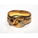 An 18 carat gold gentleman's ring in the form of two entwined snakes, set with stones