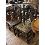 A pair of Yorkshire or Derbyshire backstool chairs, carved arched back rails with pendants over