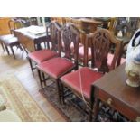 A set of six George III style shield back mahogany dining chairs, with pierced vase shape splats,