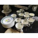 A set of eleven Crown Ducal 'Gay Meadow' pattern coffee cups and saucers, and an extra saucer