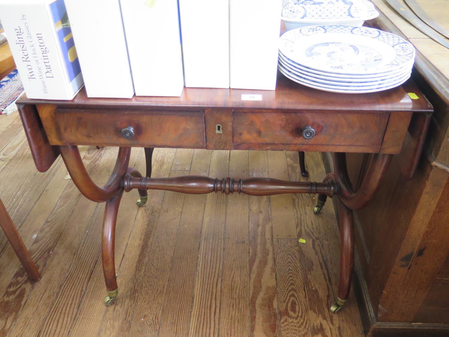 A 19th century continental style sofa table, with two frieze drawers on X-frame supports, joined