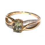 A peridot ring set in 14 carat gold