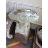 A staddle stone, the top fixed to the base, 48 cm diameter, 71 cm high
