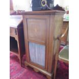An Edwardian mahogany and satinwood crossbanded music cabinet, the raised back over a glazed and
