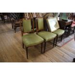 A set of four Edwardian mahogany and satinwood crossbanded dining chairs, the rectangular