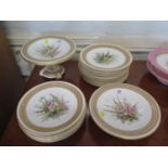 Fourteen Royal Worcester plates, with blue and tan border, each hand painted with a floral centre,