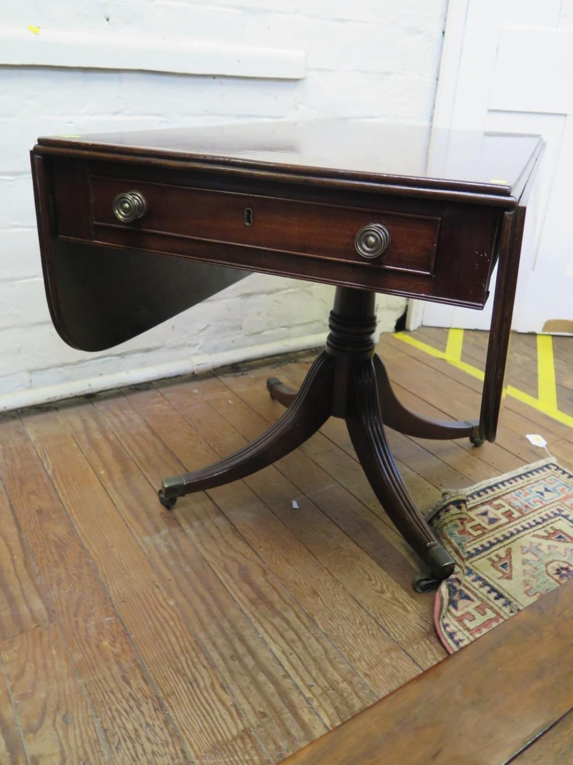 A Regency mahogany Pembroke table, the rectangular top with drop leaves over a single frieze - Image 2 of 2