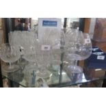 A set of six Waterford Crystal small water goblets, a large water goblet and two brandy balloons,