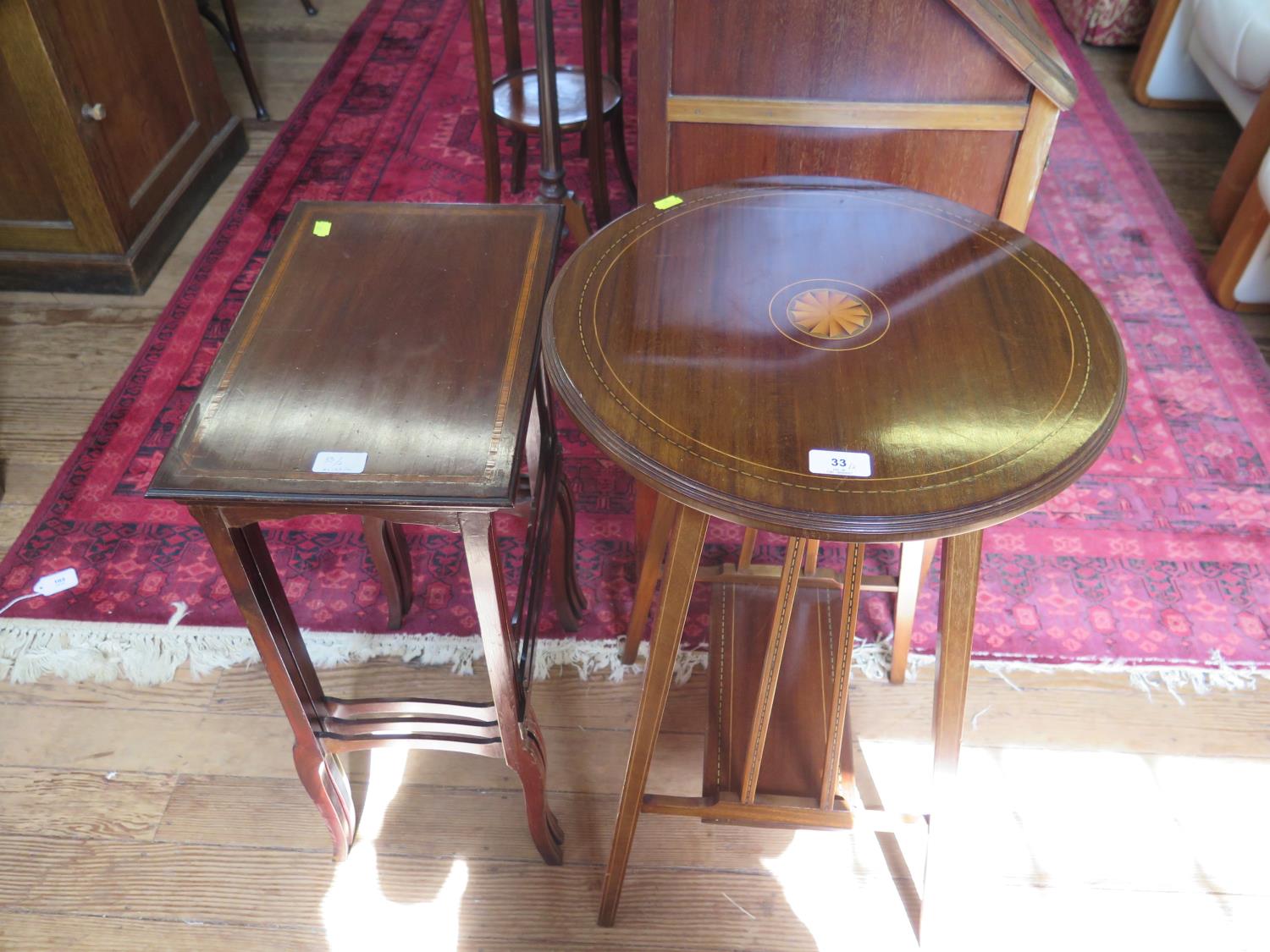 An Edwardian inlaid mahogany window table, the circular top with patera inlay on square legs