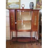 An Edwardian mahogany and satinwood crossbanded display cabinet, the protruding cornice over a bowed