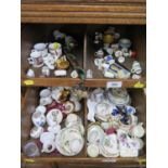 A collection of miniature teawares, including Coalport, Wedgwood and Spode, thimbles, miniature