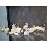 Four various Beswick figures of cats, another (marked as a second), and three Royal Doulton