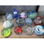 Twelve large paperweights, unmarked