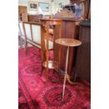 An inlaid mahogany tripod torchere stand, the foliate inlay top on boxwood strung tapering stem