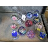 A collection of small paperweights, including Caithness, Island Studio and others