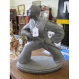 Cast figurine of a Japanese Samurai about to unsheathe his sword