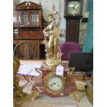 A late Victorian gilt spelter and pink marble mantel clock, the figure of a gardener (after