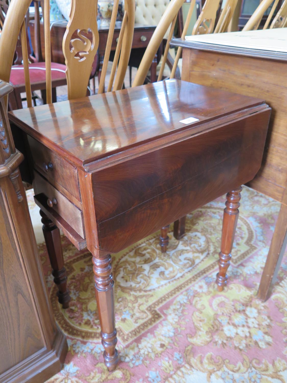 A mid 19th century Anglo-Italian mahogany Pembroke table, the rectangular top over two frieze