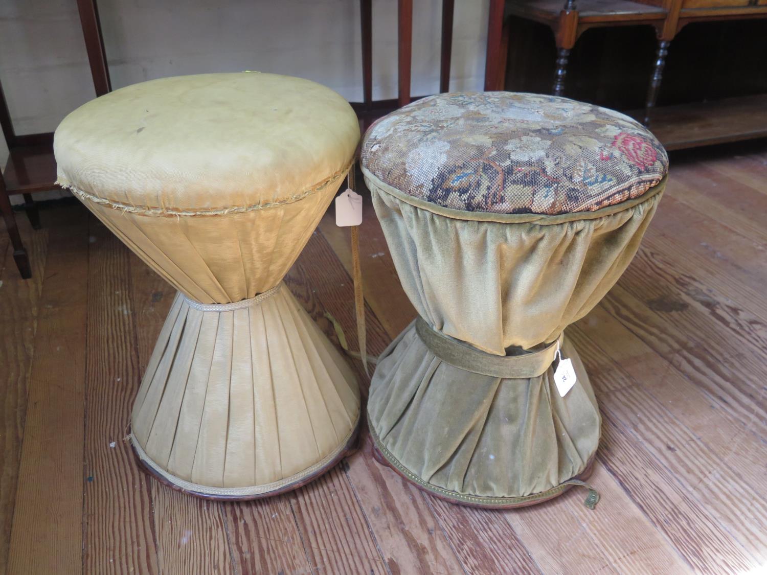 A pair of Victorian upholstered stools, of waisted design, one with original woolwork seat, on pad