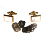 A pair of silver cufflinks and a fashion pair of links