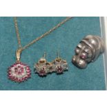 A ruby and faux diamond pendant necklace and earrings, and a silver hippo Russian silver
