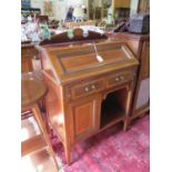 An Edwardian mahogany and satinwood crossbanded bureau, the inlaid raised back over a panelled
