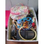 Box of costume jewellery with a Ronson lighter and small shovel