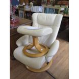 A Stressless cream leather adjustable armchair and foot stool (2)