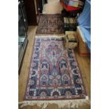 A Chinese Persian style prayer rug, with all over floral design on a blue field 171 x 90 cm, and