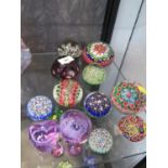 A collection of paperweights, mostly millefiori and a Caithness