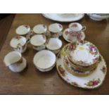 A set of six Royal Albert Old Country Roses tea cups, saucers and side plates, with serving plate,